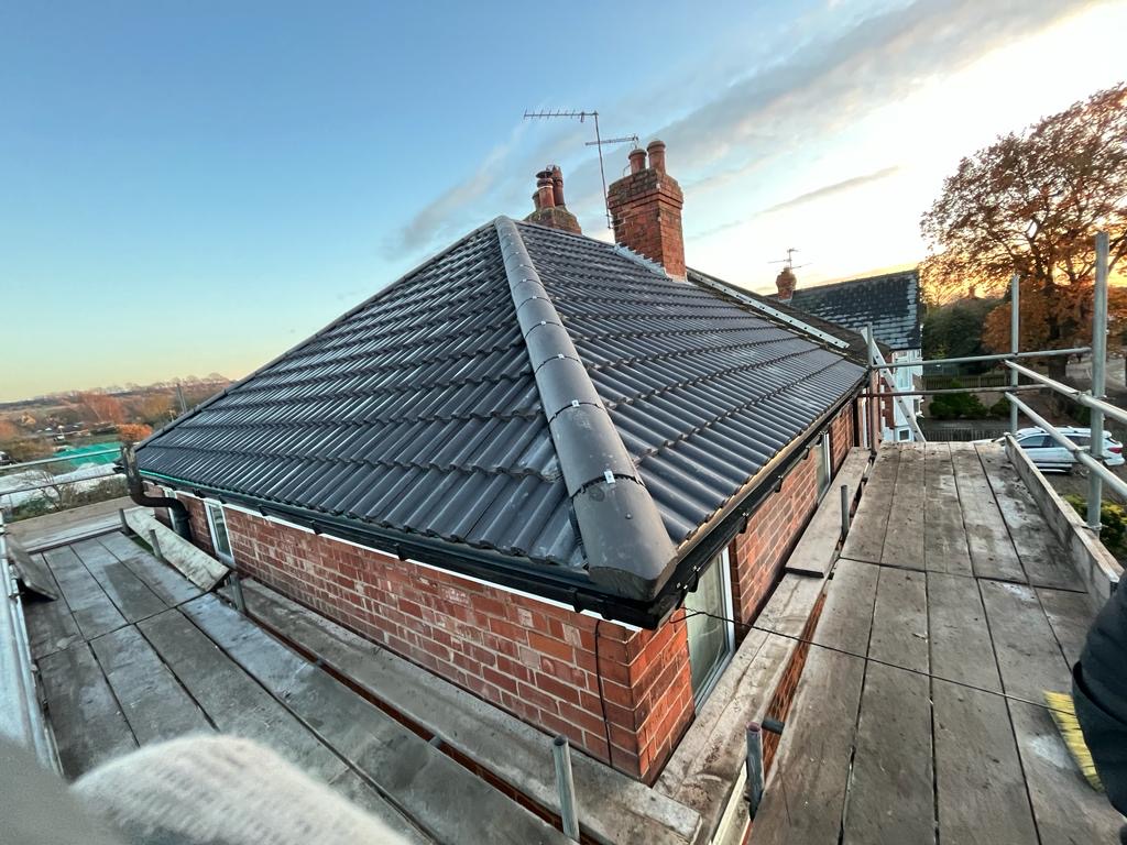 Completed hip roof at sunset